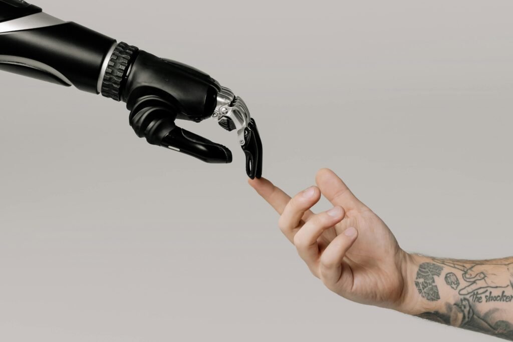 A robotic hand touching a human finger, symbolizing AI-powered technology in daily life.