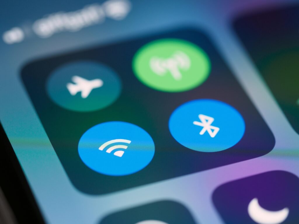 Close-up of a smartphone control center showing Wi-Fi, Bluetooth, and airplane mode icons.